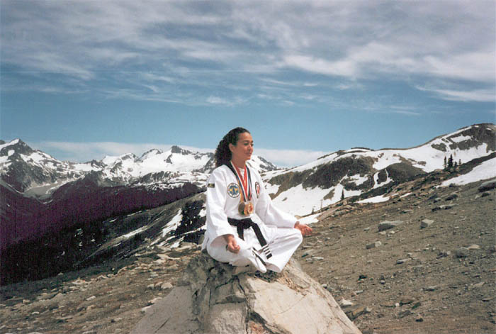 Master Dawn sitting on top of Whistler mountain in lotus pose
